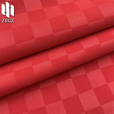 China 100% Plaid Jacquard Clothing Jacket Fabric Polyester Leatherette Bag Shoe Flame Retardant Material for sale