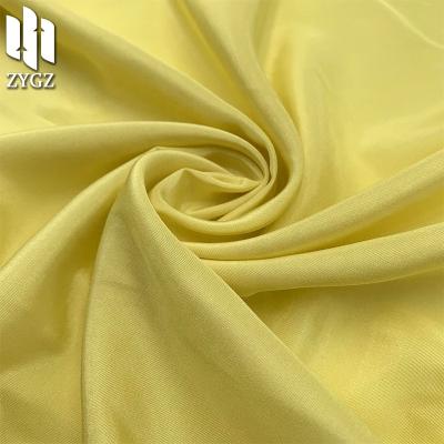 China Bright pure diamond satin rayon polyester blended fabric high quality and cheap woven women's clothing fabric for sale