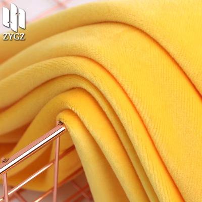 China Soft knitted velor fabric Shrink-resistant polyester flannel clothing fabric polyester spandex soft toy cushion coat quilt fabric for sale