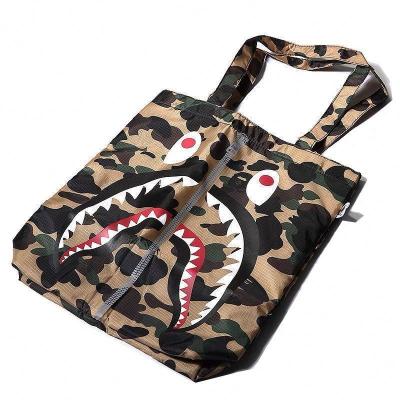 China INS Hot Water Proof BAPE Bags Red Camouflage Shark Eyes Black Teeth Print Simulated Zipper Tote Bags Trendy Shoulder Couple Bags for sale