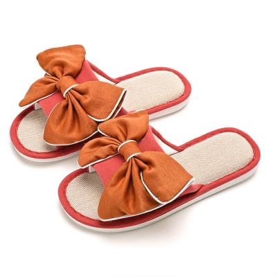 China Lightweight Comfortable Indoor Winter Fabric Bedroom Home Slippers With Bow for sale