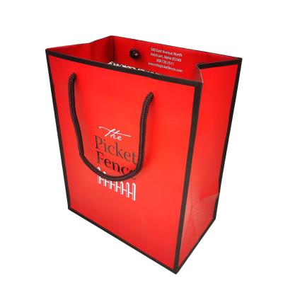 China Handmade Luxury Clothing Kraft Embossing Paper Shopping Bags With Your Own Logo for sale