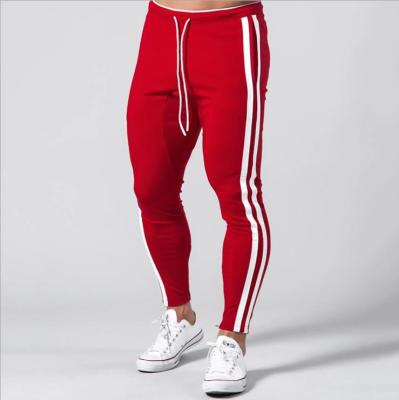 China Best Foot Jogger Design Side Stripe Anti-Static Band Pants Mens 2021 Autumn Sports Leisure Trousers For for sale