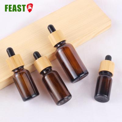 China Personal Care 30ml 50ml 100ml Bamboo Dropper Amber Essential Oil Bottle For Personal Care for sale