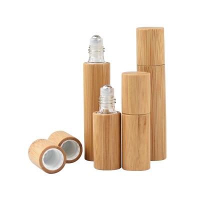 China Refillable Cosmetic In Stock Iso+Bsci Bamboo Lid Roll On Essential Oil Roller Glass Bottle For T Zone for sale