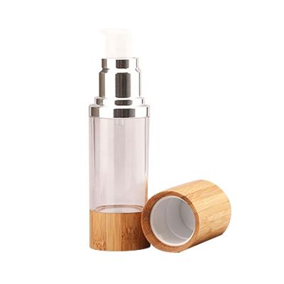 China 30ml Cosmetic Pump Bottle Small Airless Empty Lotion Bottle PET With Bamboo Bottom And Cover for sale