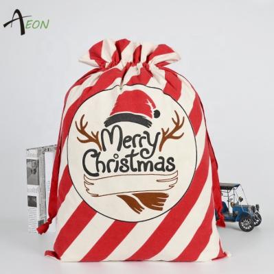 China Christmas Storing Large Stripe Cotton Canvas Santa Sack Bag With Drawstring Christmas Decoration Gift Santa Bags for sale