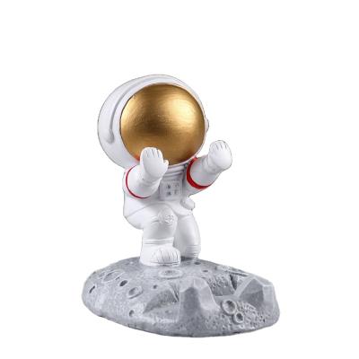 China 2021 China Figurine Decor Resin Character Astronaut Christmas Ornament Handcrafted Modern Home Desk Phone Stand for sale