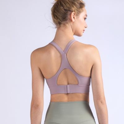 China 2021 Wireless Strap Yoga Bra Seamless Fitness Yoga Bra Cross Back Top Strap Seamless Breathable Top Bra For Women for sale