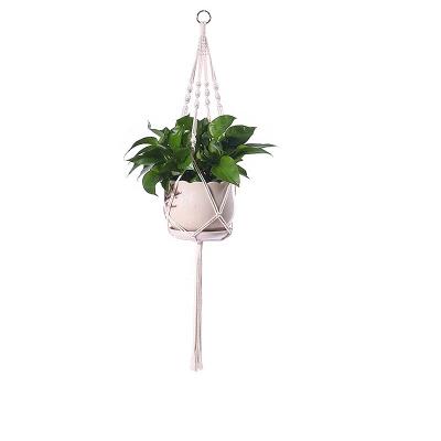 China Macrame Bohemian Plant Baskets Boho Plant Hangers Balcony Decorations Flower Pot Indoor Hanging Net Rack with Metal Earrings for sale