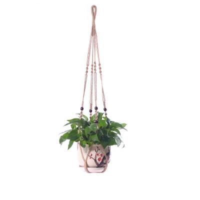 China New Design Bohemian Macrame Plant Hanging Baskets Flower Pots Rack Balcony Tied Lifting Rope Macrame Plant Hangers Garden Decor for sale