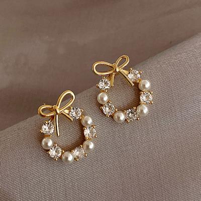 China TRENDY Luxury Pearl Bow knot Stud Earrings For Women Korean Fashion Jewelry for sale