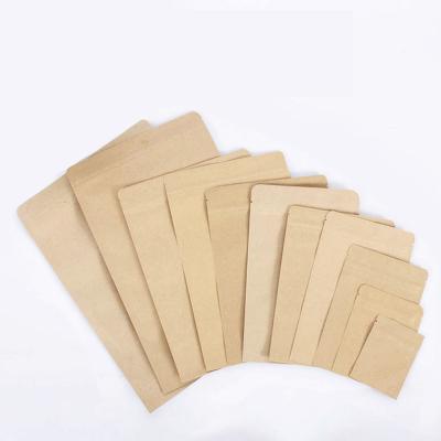 China Recycled Materials Kraft Paper Three Side Seal Zipper Bag With Foil for sale