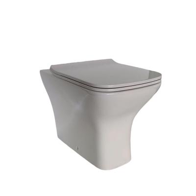 China Modern Rimless P-trap Double Flush Washdown Back To Wall Pan Modern Ceramic Toilet Sanitary Ware for sale