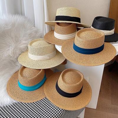 China Fashion To Keep Hot Women Overflow Wheat Straw Hat Ribbon Flat Top Straw Hat Straw Hat Summer Sun Beach for sale