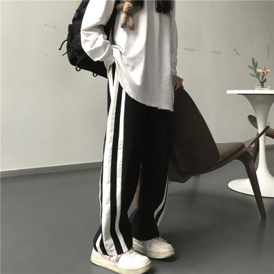 China Viable Wholesale Casual Ladies Pockets Women Long Pants Drawstring Waisted Side Striped Sports Fitness Long Pants for sale