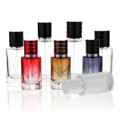 China High End Personal Care Cylinder Shaped Perfume Bottles 50ml 100ml Empty Clear Glass Atomizer Perfume Bottle With Black Cap for sale