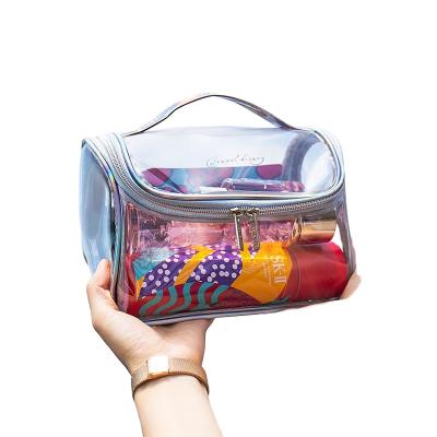 China Portable Large Capacity PVC Cosmetic Transparent Makeup Bag Lady Bag Waterproof Toiletry Bag for sale