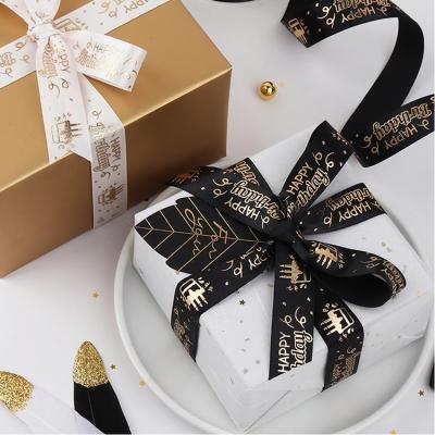 China Recyled Yiwu factory custom logo 1 inch 25 mm 100% polyester printed gold foil satin ribbon for gift wrapping for sale