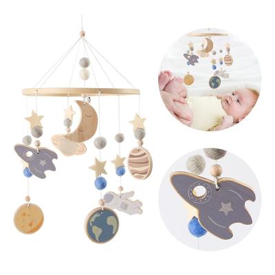 China Cartoon Wooden Crib Bell Felt Toys Crib Star Baby Handmade Hanging Mobile Astronaut for sale