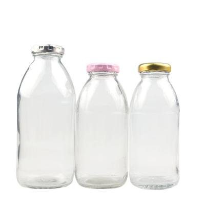 China Popular 300ml 350ml 500ml Empty Clear Glass Beverage Milk Bottle Fruit Juice Bottle With Lid for sale