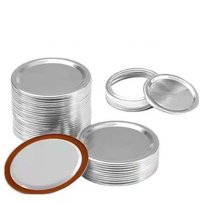 China Non Spill Hot Sale 70mm Bulk Regular Silver Mason Jar Lids Flat Canning Caps for sale