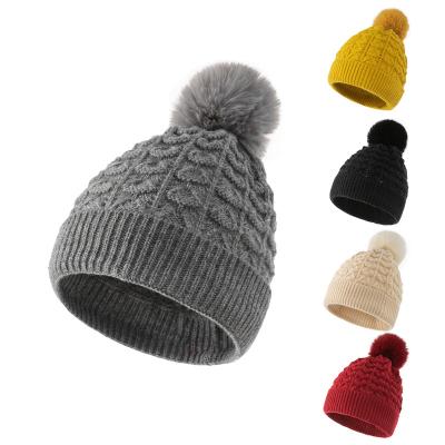 China Fashionable Custom Acrylic COMMON Beanie Winter Hat With Pom Pom From Popular Jacquard Design Wholesale for sale