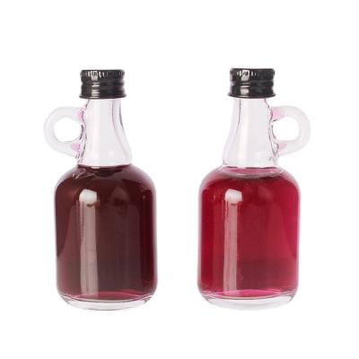 China 40ml 100ml Glass Alcoholic Beverage Round Whiskey Brandy Rum Liquor Bottle With Handle for sale