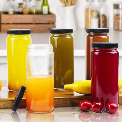 China 16oz Reusable Wide Mouth Glass Beverage Drinking Juicing Bottles With Plastic Lid for sale