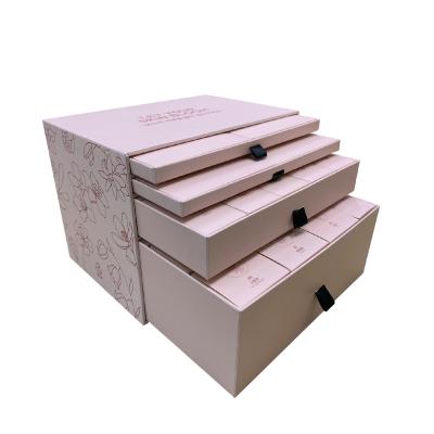 China Handmade Holiday Advent Calendar Packaging Box With 4 Drawers Inside Color Draw Beauty Packaging Design Pink Box for sale