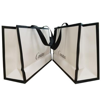 China Recycled Recyclables Simply Design Blank Black Paper Bag Embossed Printing Printing Black Thick Black UV Garment Art Paper Shopping Bag for sale