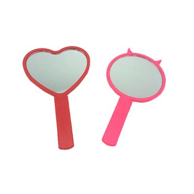 China OEM Return Maid Customized Cute Compact Cosmetic Plastic Small Handheld Foldable Devil Small Heart Shaped Mirror With Handle for sale