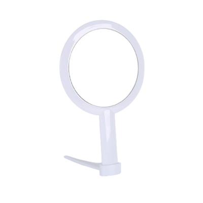 China Hot Sale Good Quality Simple Design Simple Design Handle Magnifying Small Size Portable Plastic Cosmetic Folding Mirror for sale