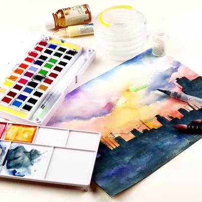 China Superior 24/36/48 Solid Non-Toxic Solid Watercolor Paints Pigment With Water Brush Pen For Painting Transparent Acuarela Art Supplies Gift for sale