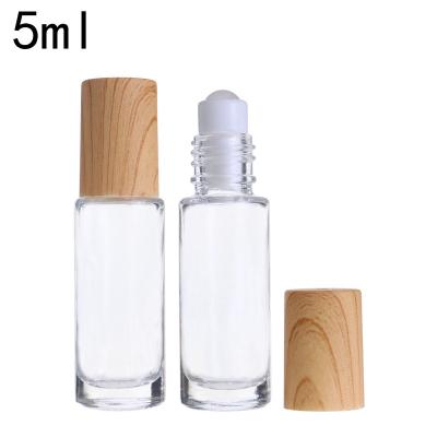 China Hot Selling Personal Care 5ml Clear Glass Roll On Perfume Bottle With Bamboo Cover for sale