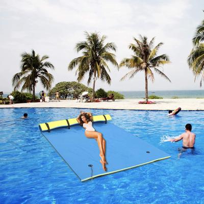 China Extra Large Eco-Friendly Material Floating Mat 3 Layer 18 x 6 Feet Water Play Giant Floating Water Pad With Pillow Straps for sale