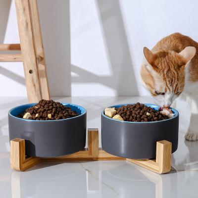 China Sustainable Wholesale Custom Pet Bowl Wooden Stand Non Slip Ceramic Pet Food Bowl High Feeding Water Double Bowl for sale