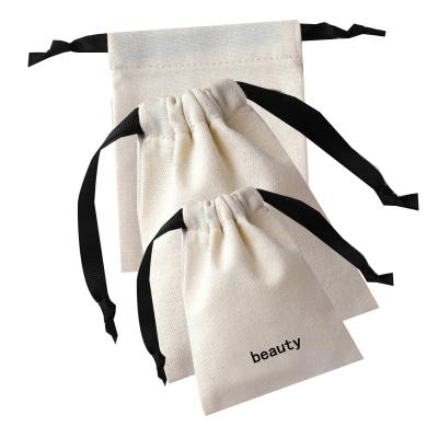 China Trendy Custom Logo Satin Ribbon Jewelry Pouch Small Organic Recycle Eco Friendly Jewelry Gift Bags Canvas Cotton Drawstring Bag for sale