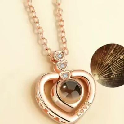 China Environmental Friendly Rose Gold Silver Projection Zircon Heart Rose Pendant Necklace 100 Languages ​​Love Memory Necklace I Love You for sale