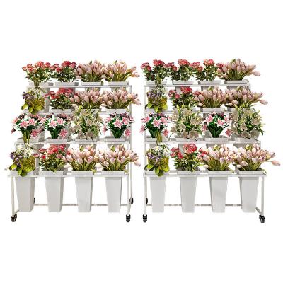 China Multilayer Creative Floor-standing Modern Wrought Iron Flower Stand On Balcony Dedicated To Florist for sale