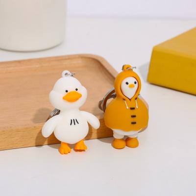 China Eco-friendly Creative Cute Cartoon Duck Keychain Raincoat Duck Couple Key Chain Pendant Small Gifts for sale