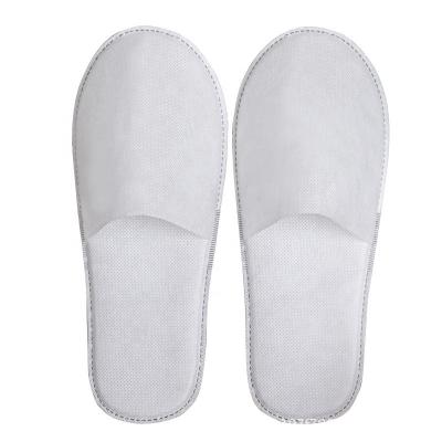 China Cheap and practical lightweight non-woven thickened non-woven hotel tasteless guesthouse disposable slippers for guest reception for sale