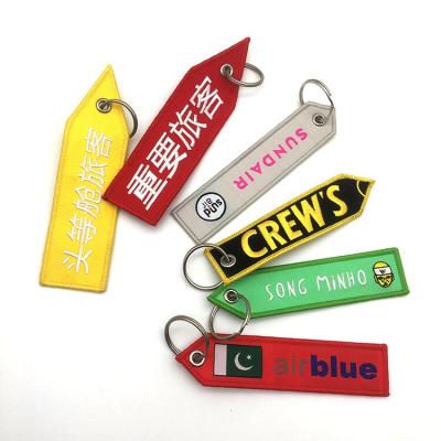 China Simplicity 2021 Super High Quality Customized Silver Or Black Double Sided Full Color Embroidered Logo Spray Key Chain Tag for sale