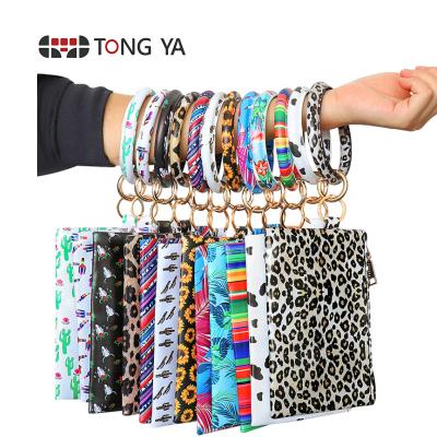 China Hot Sale Waterproof Personalized Leather Bracelet Tassel Key Chain Enamel Disc Wallet Round Key Chain for sale