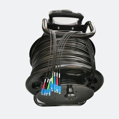 China Easy Assembly Portable retractable fiber optic cable reel with length 100M 200M 500M  armored tactical fiber optic patch cord for sale