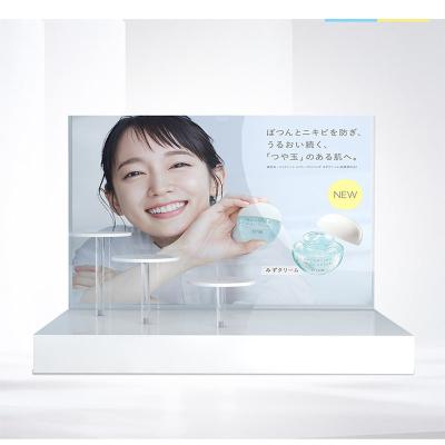 China Supermarkt make-up display stand Acryl cosmetisch display met witte display risers Te koop