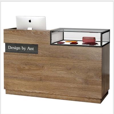 China Retailer Shops Modern Wood MDF Checkout Reception Desk with Glass Box Checkout Counter for sale