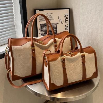 China Portable Lightweight Ladies Out Short Travel Bag Large-Capacity Bag Ladies New Summer Canvas Messenger Bag for sale