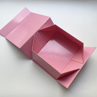 China Custom Luxury Glossy Pink Package Folding Paper Box Magnetic Foldable Gift Box With Magnetic Lid for sale