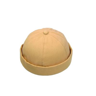 China Retro COMMON Cuff Bowler Brimless Rolled Hat No Brim Sports Hats for sale